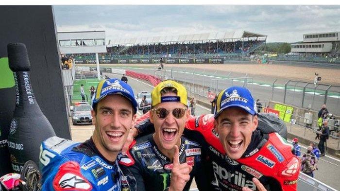 Para pemilik podium MotoGP Inggris 2021 yakni Alex Rins (kiri), Fabio Quartararo, dan Aleix Espargaro, di Sirkuit Silverstone, Minggu (29/8/2021).
