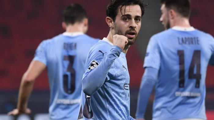 Bernardo Silva merayakan gol pertama di babak 16 besar Liga Champions UEFA Borussia Moenchengladbach vs Manchester City di Puskas Arena di Budapest pada 24 Februari 2021.
