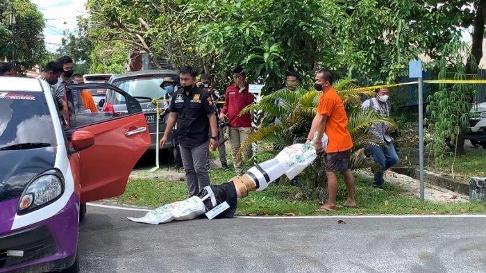 Rekonstruksi pembunuhan Sarwani oleh pra tersangka di Maoolresta Palangkaraya, Selasa (12/4/2022) kemarin.