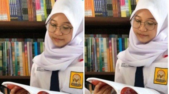 Rheisya Andreanisa sedang membaca buku yang merupakan salah satu hobinya.