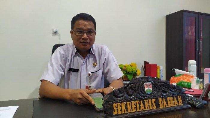 Caption: Sekretaris Daerah Minahasa Tenggara, David Lalandos
