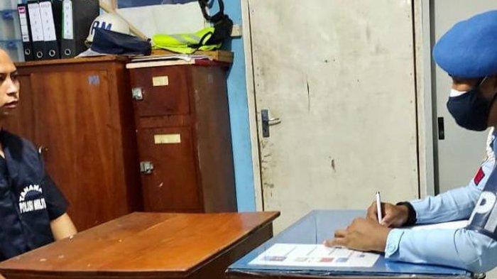 Salah satu anggota POM Lanud Yohanes Abraham Dimara Merauke, tengah menjalani pemeriksaan setelah melakukan aksi kekerasan kepada seorang pemuda, Steven, Papua, Selasa (26/7/2021).